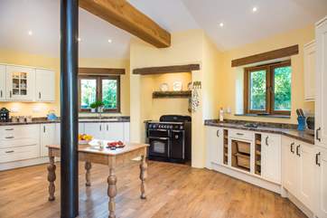 The kitchen is wonderfully light and airy and has plenty of room so everyone can help prepare your holiday meals.