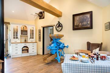 The fully restored grain mill takes pride of place in the kitchen.