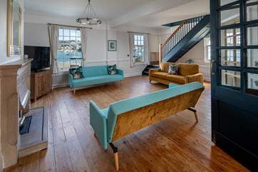 The spacious sitting-room is the perfect spot to relax and unwind in following a action packed day.