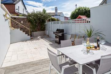 The outside patio is a fabulously private spot, perfect for enjoying the days sun.