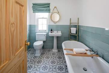 The family bathroom is home to this beautiful roll-top bath.