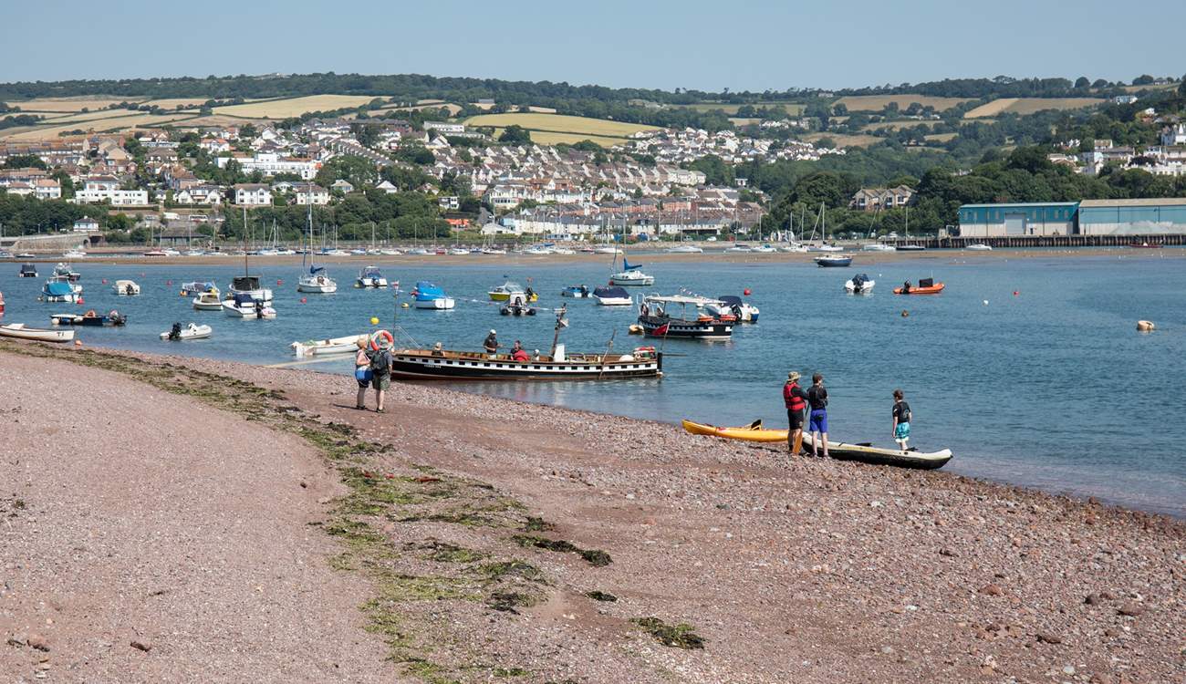Shaldon beach, bustling with water activity.