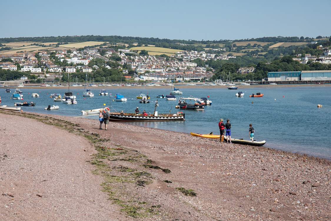 Shaldon beach, bustling with water activity.