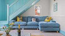 Snuggle up on this sumptuous sofa, minding your head on the stairs of course.