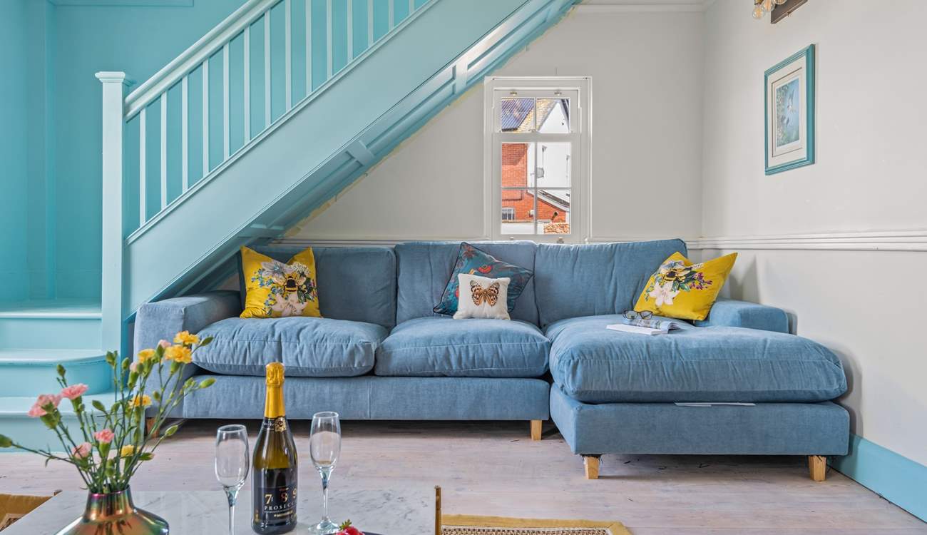 Snuggle up on this sumptuous sofa, minding your head on the stairs of course.