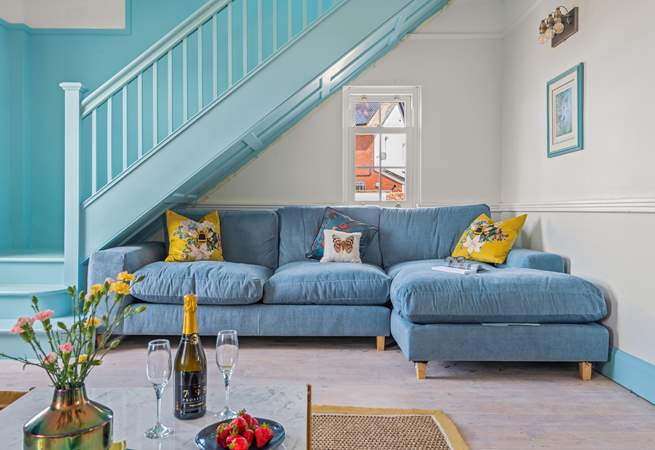 Snuggle up on this sumptuous sofa, minding your head on the stairs of course.