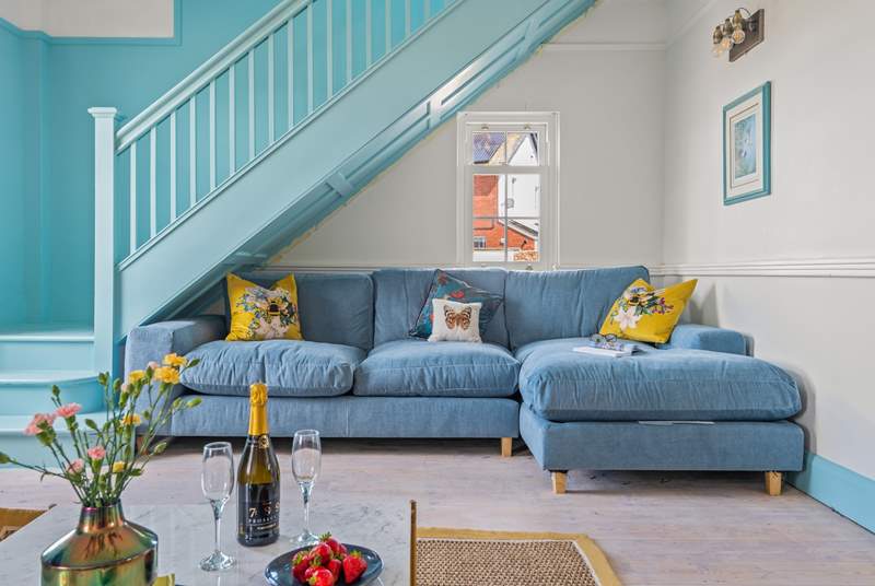 Snuggle up on this sumptuous sofa, minding your head on the stairs of course.