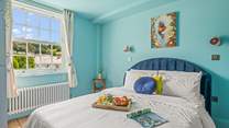 Bedroom 2 is light and inviting and is home to this super-king size bed.