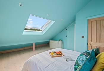 Light and airy bedroom five boasts views over Teignmouth back beach and the delightful array of beach huts.
