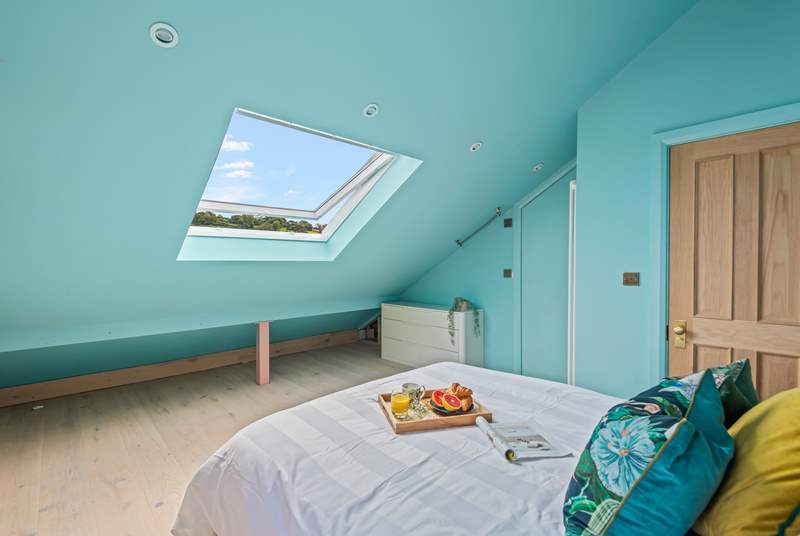 Light and airy bedroom five boasts views over Teignmouth back beach and the delightful array of beach huts.