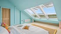What a view to wake up to in the morning. Stunning views stretch over the wider landscape of Teignmouth's back beach, Shaldon bridge, and up across to Dartmoor (bedroom six).