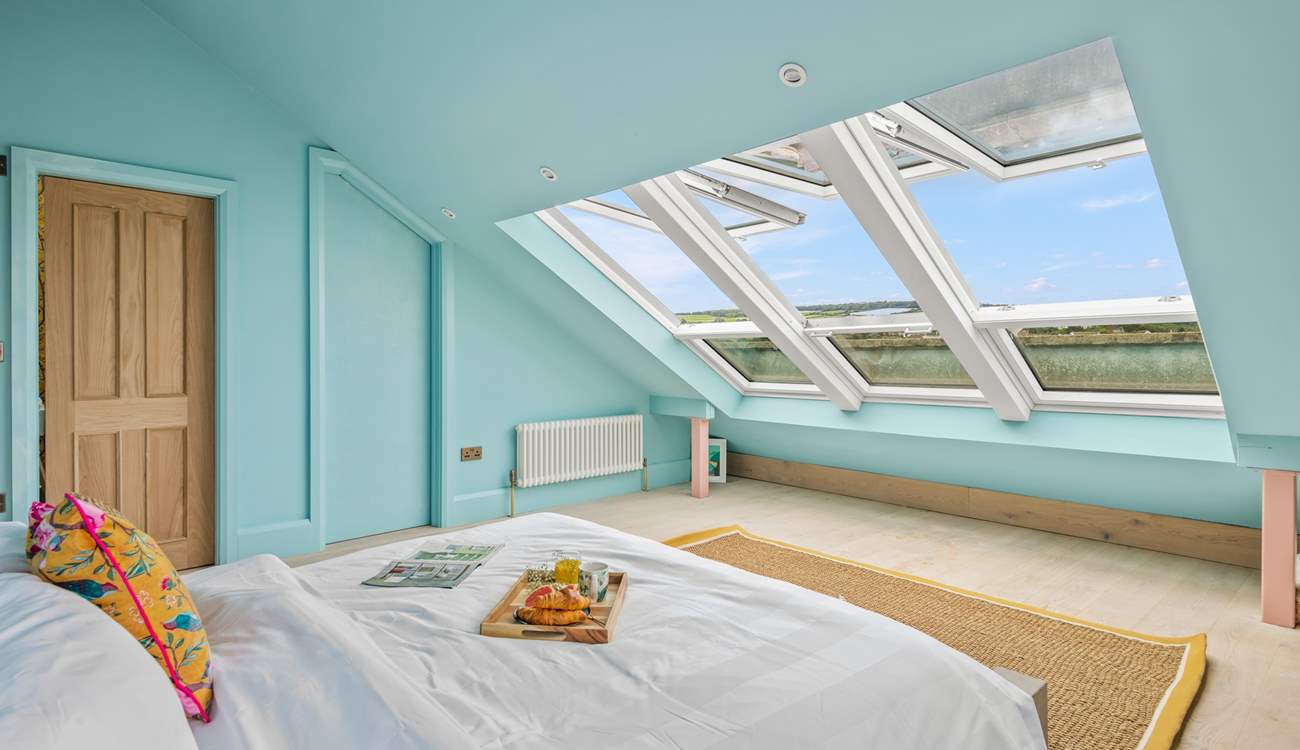 What a view to wake up to in the morning. Stunning views stretch over the wider landscape of Teignmouth's back beach, Shaldon bridge, and up across to Dartmoor (bedroom six).