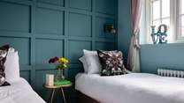 Bedroom 4 is home to a 'zip and link' super-king size bed, which transforms into these fabulous single beds.