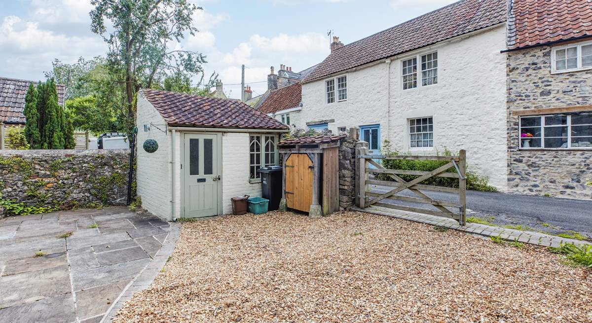 This sweet outhouse is a handy space to leave wellies and coats.