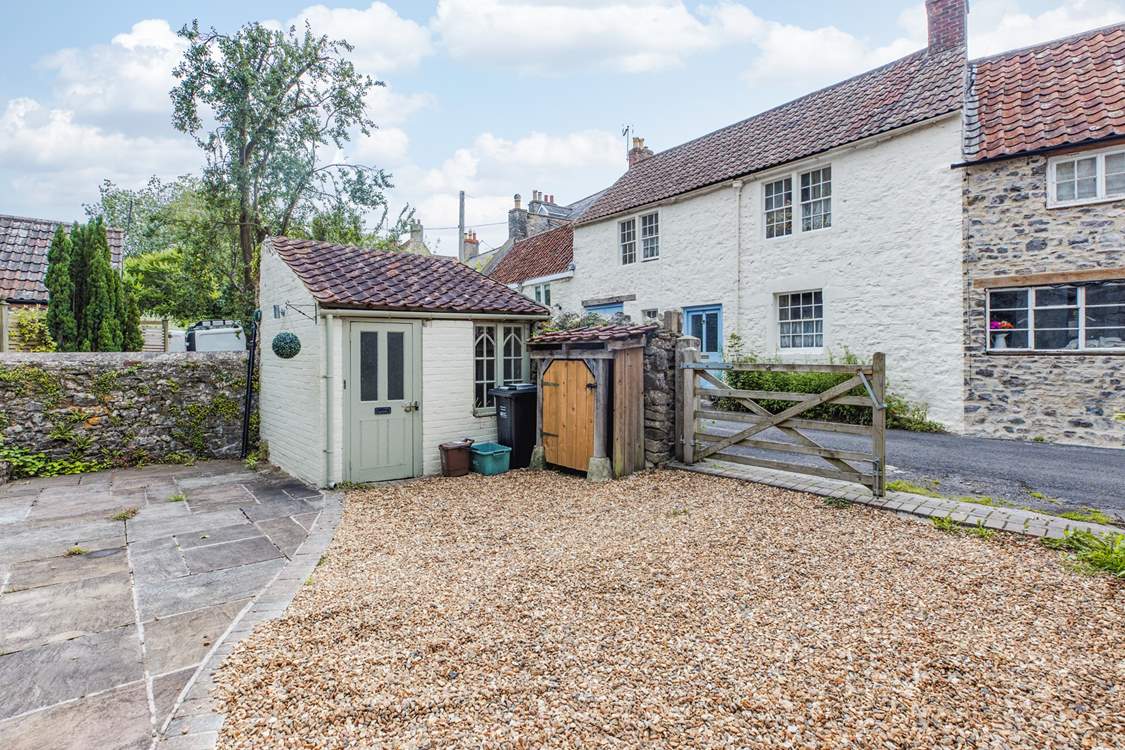 This sweet outhouse is a handy space to leave wellies and coats.