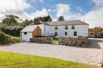 Pheasant Cottage is the cottage on the right of the picture with a large area for parking, your private garden and a lockable outhouse for your bikes, paddle boards and other equipment.
