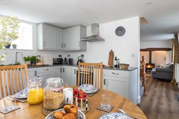 The cottage has an open plan feel between the sitting-room and the kitchen/diner.