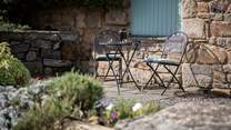 Just outside your door, in the courtyard, you have access to another seating area - perfect for enjoying your morning coffee.