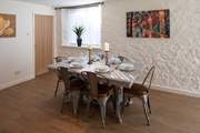 Serving up a feast and dining together at this lovely table is a must.