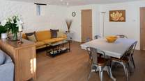 The open plan dining and sitting area.