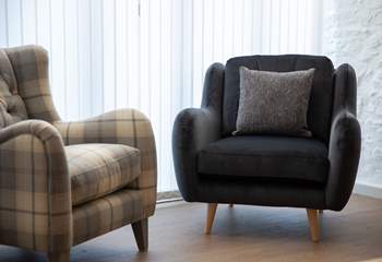 Super comfy armchairs add extra style and comfort.