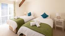 Bedroom 2 is simply gorgeous, light and airy. These single beds also link into a super-king double bed.
