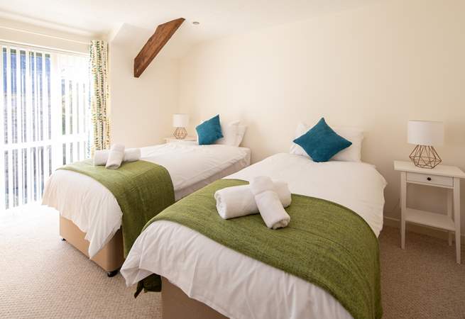 Bedroom 2 is simply gorgeous, light and airy. These single beds also link into a super-king double bed.