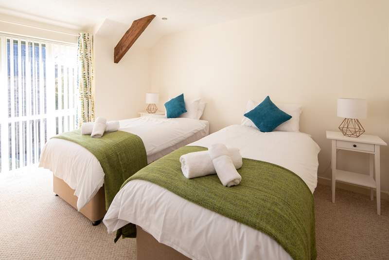 Bedroom 2 is simply gorgeous, light and airy. These single beds also link into a super-king double bed.