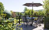 One of the beautiful patio areas. Perfect for enjoying a moment of peace and quiet with a good book.  - Thumbnail Image