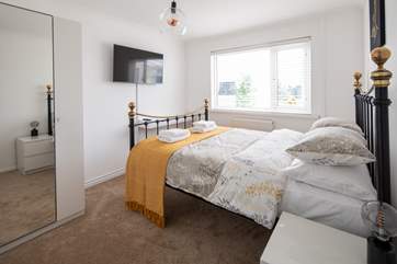 Bedroom 1 with king-size bed and Smart TV.