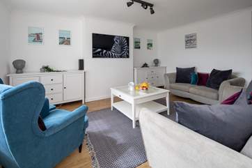 The sitting-room is a fabulous space to snuggle up in at the end of a busy day.