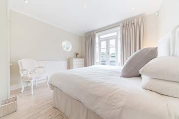 The modern and spacious second bedroom facing the front of the property.