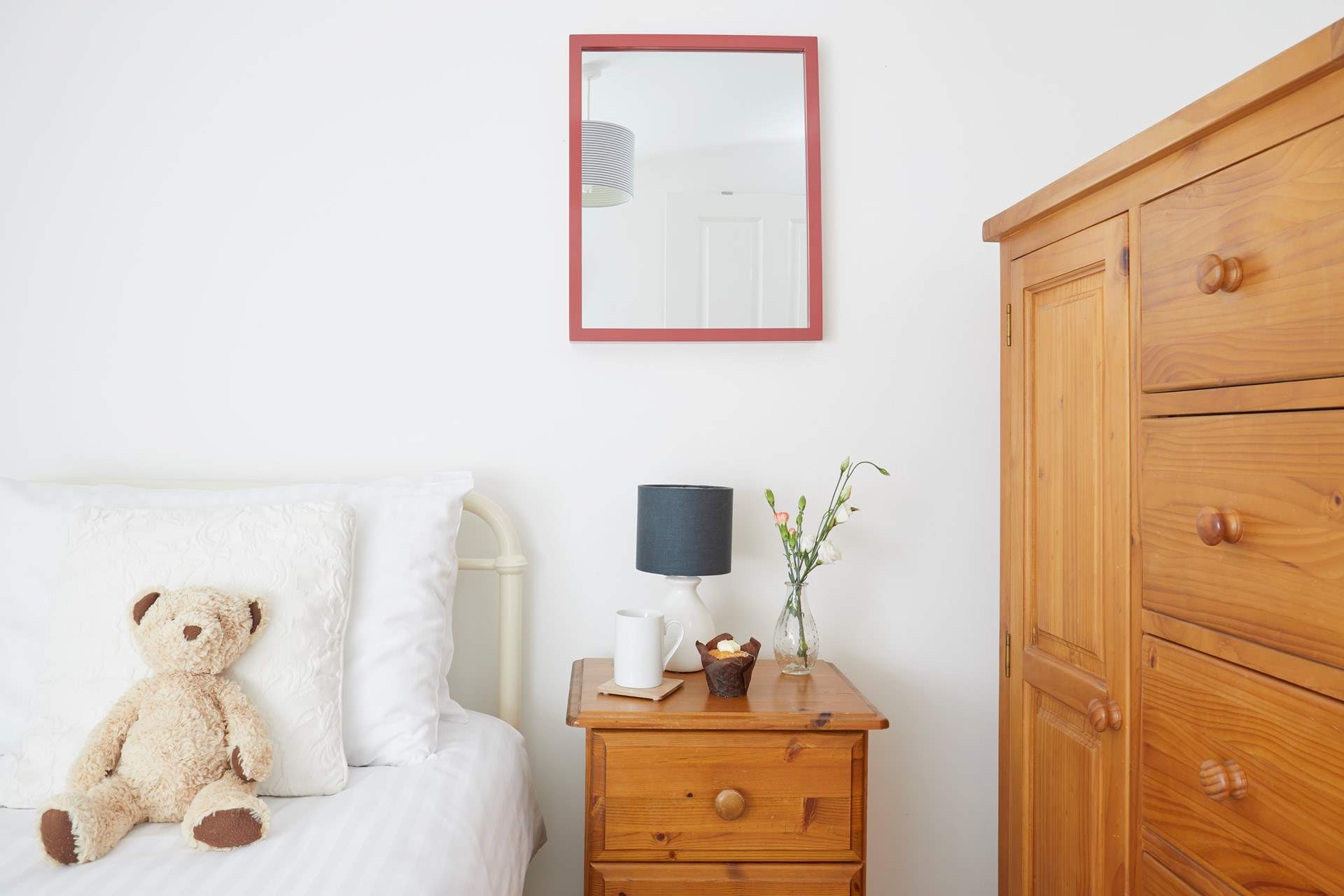 This single bedroom offers comfort and calm.