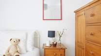 This single bedroom offers comfort and calm.