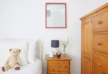 This single bedroom offers comfort and calm.
