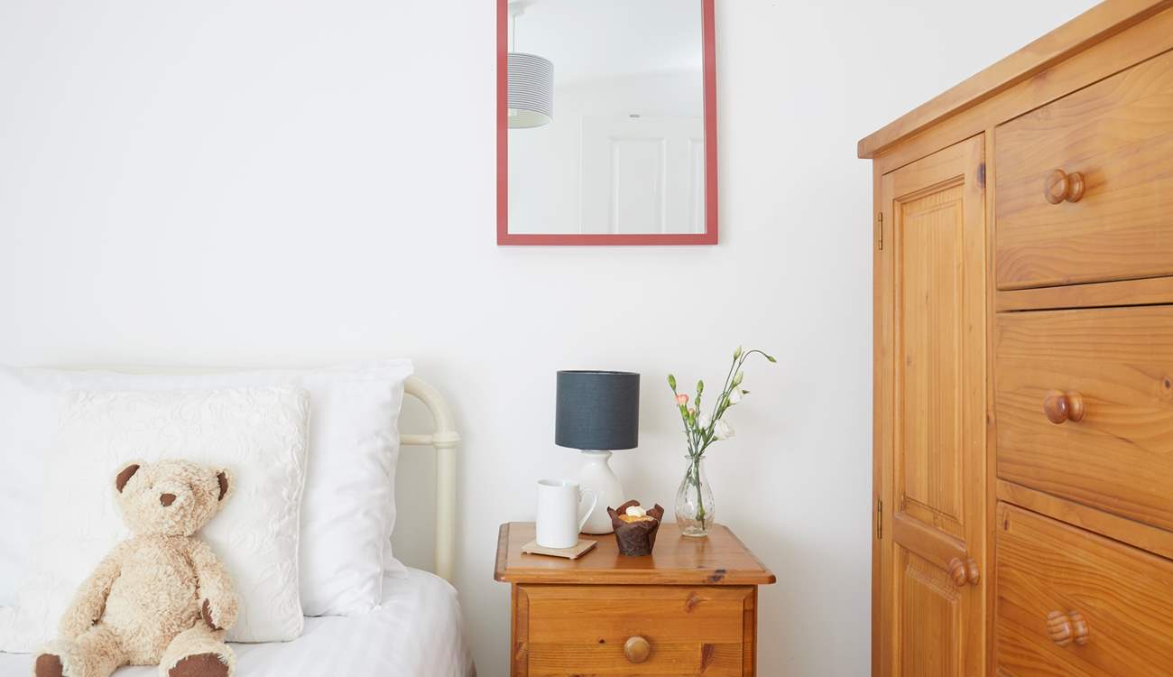 This single bedroom offers comfort and calm.