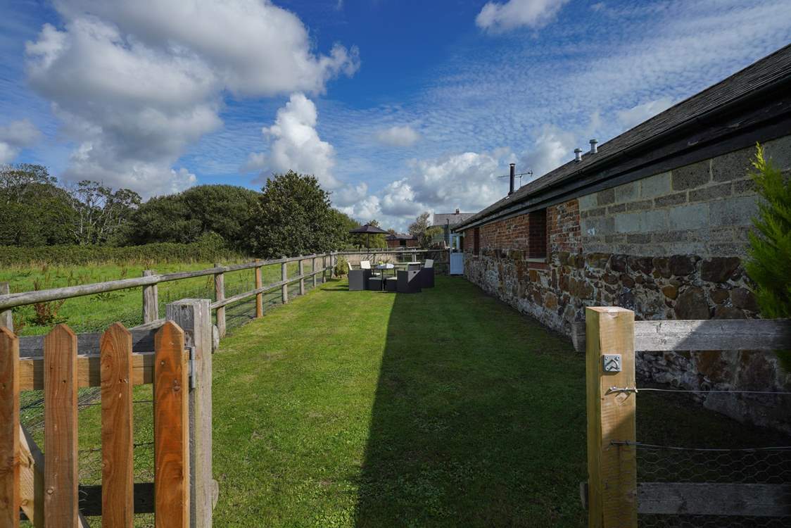 Take advantage of the enclosed garden area with soft furniture seating.