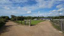... within 100 yards you will notice the barns on your right-hand side. 