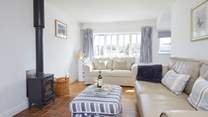 With large windows and a door leading to the garden, this is a lovely spot to relax and enjoy the sunshine.