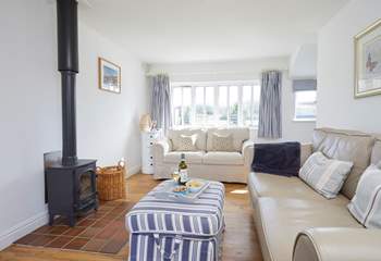 With large windows and a door leading to the garden, this is a lovely spot to relax and enjoy the sunshine.