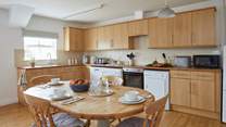 The spacious kitchen/dining-room is well-equipped.  