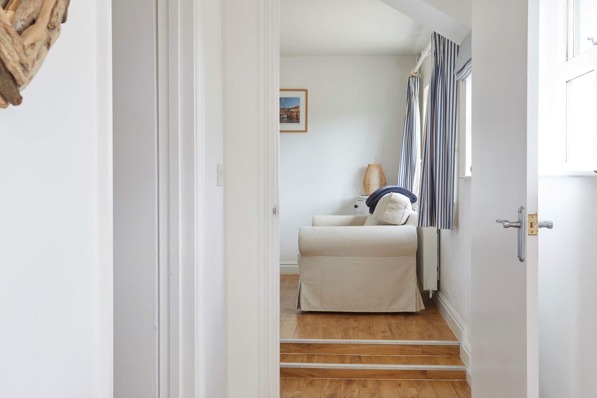 Please take care as there are two steps leading into the sitting-room.