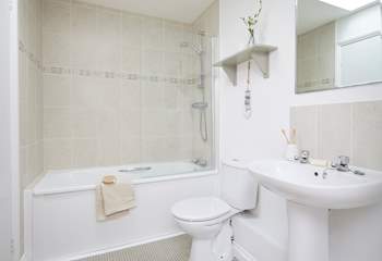 The family bathroom with bath and fitted shower.