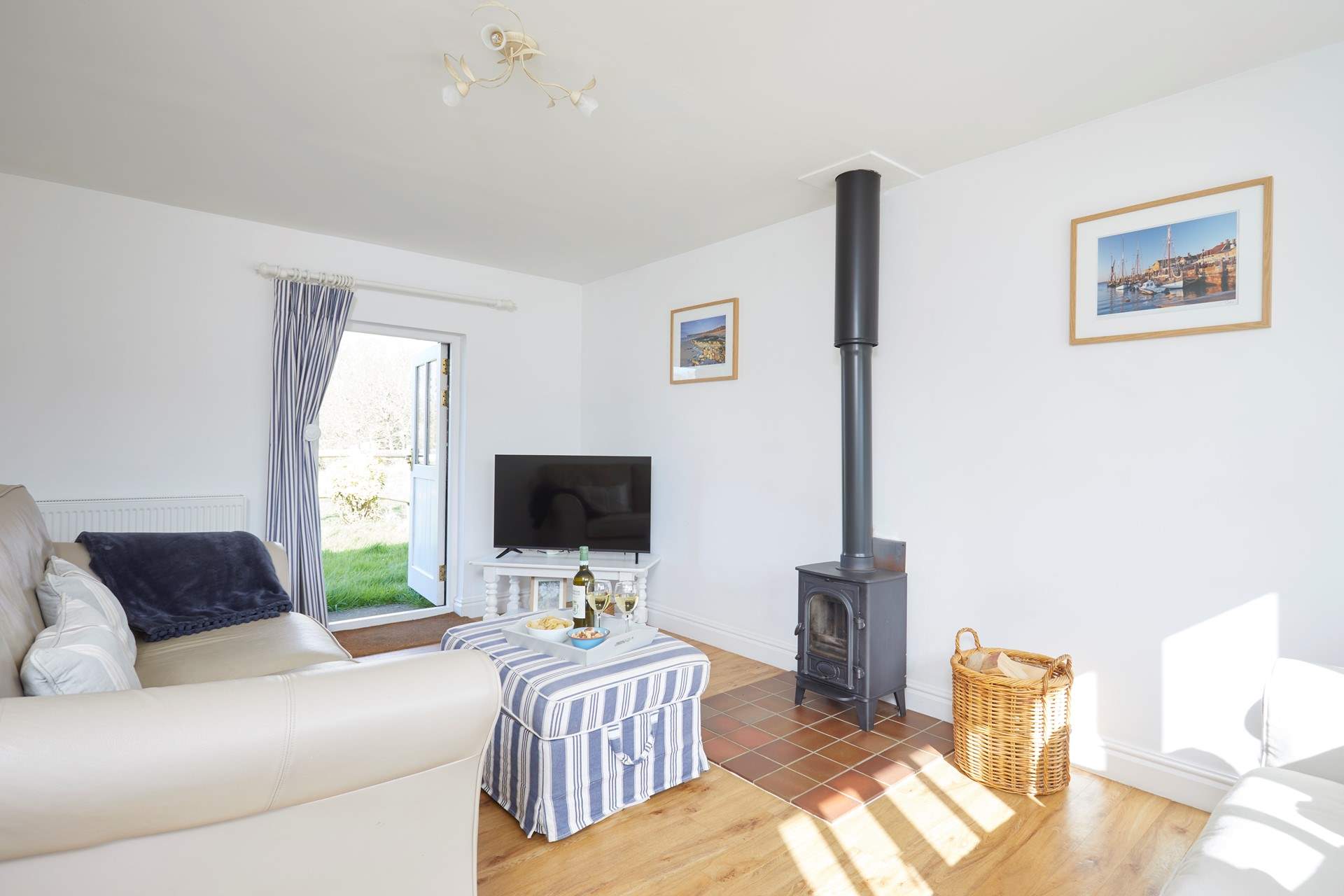 The lovely sitting-room leads out into the garden. 