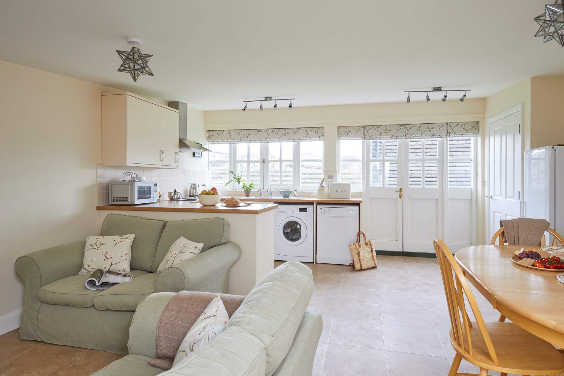 The spacious open plan living-room with kitchen and dining areas. 