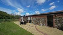 Relax with your own enclosed garden area overlooking the grounds.