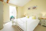 The spacious double bedroom overlooks the front garden area.