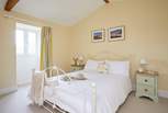 The spacious double bedroom overlooks the front garden area.