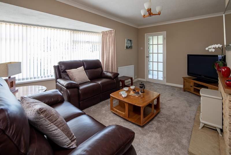 The sitting-room is super-comfy and provides a lovely space to relax and unwind in.