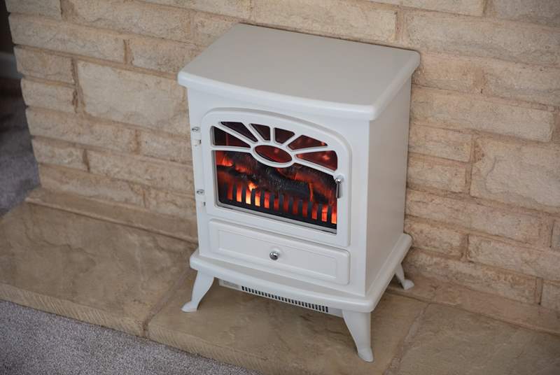 Flick on the wood-burner effect electric stove to perfect that cosy night in.